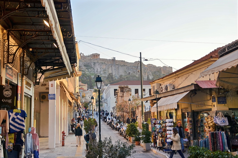 Aiolou Street in Athens, Greece, looking south toward the historic center with the Acropolis and the Parthenon visible in the background